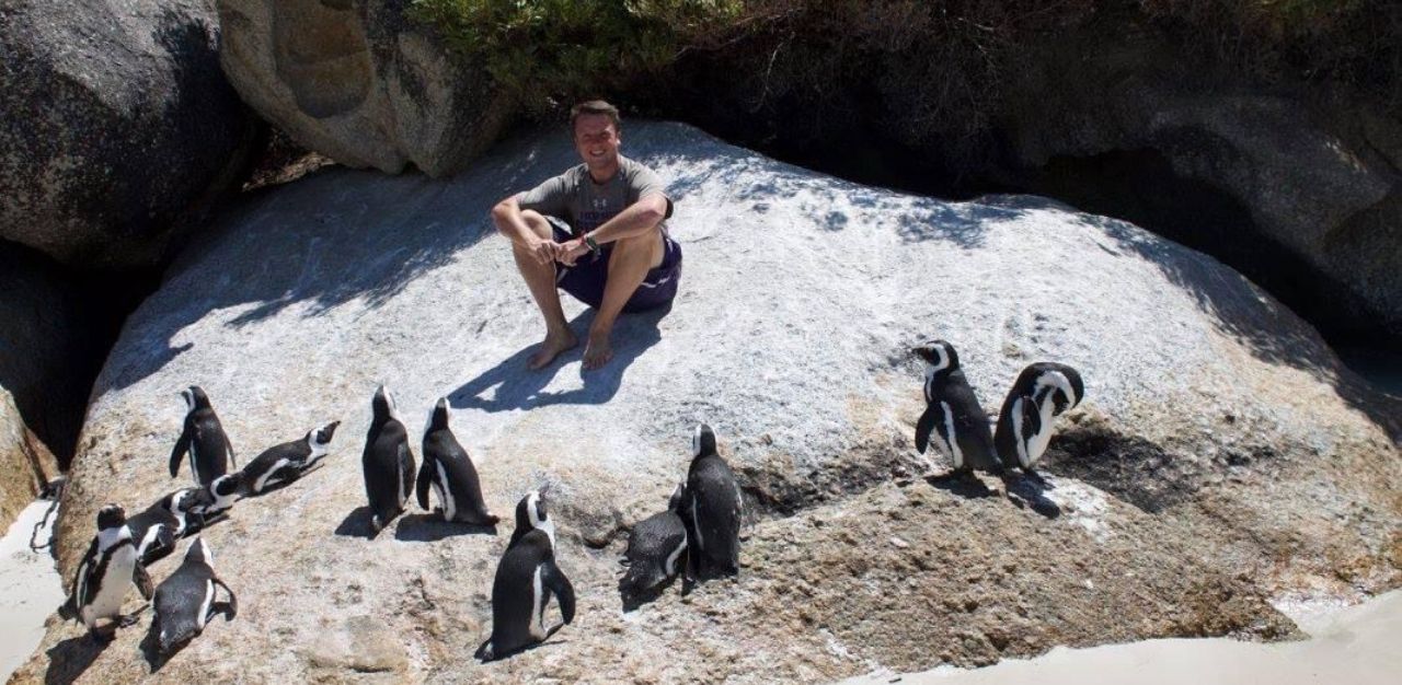 ICW Brent Folan with penguins in Africa